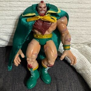 Green and Yellow Action Figure with Cape collectible